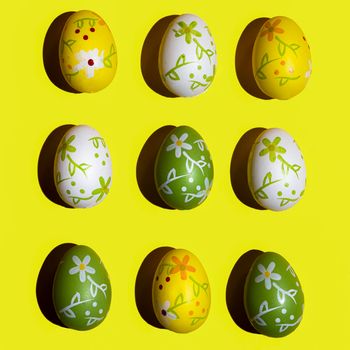 Some decorated Easter eggs on a yellow surface