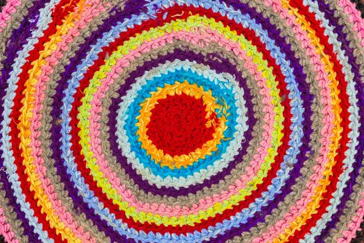 Traditional Russian round knit Mat handmade colorful concentric circles background