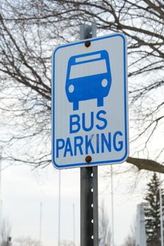 A roadside bus parking sign for designated areas in the local community.