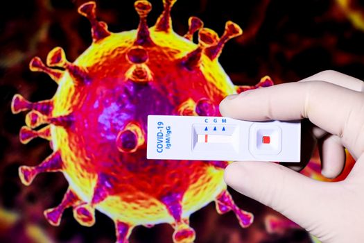 Medical worker holding negative rapid Diagnostic Test cassette identifying antibodies for Coronavirus SARS-CoV-2 COVID-19 on microscopic image of covid virus
