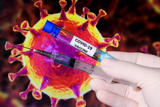 Glass vials with Covid-19 virus vaccine and covid virus microscopic image in the background