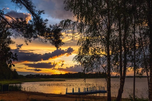 Amazing sunset at the Braslaw lakes with the cloudy sky. Braslaw district, Belarus.