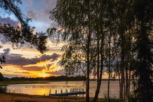 Amazing sunset at the Braslaw lakes with the cloudy sky. Braslaw district, Belarus.