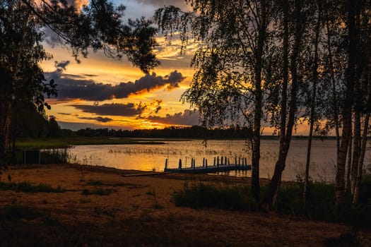 Amazing sunset at the Braslaw lakes with the cloudy sky. Braslaw district, Belarus.