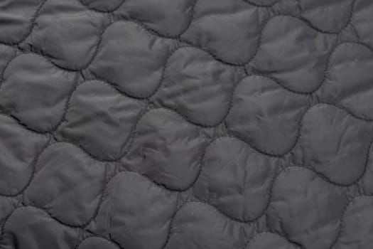 Close-up of a piece of quilted fabric, jacket lining