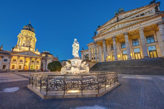 The Gendarmenmarkt square in Berlin with the monument to Schiller at dawn with no people