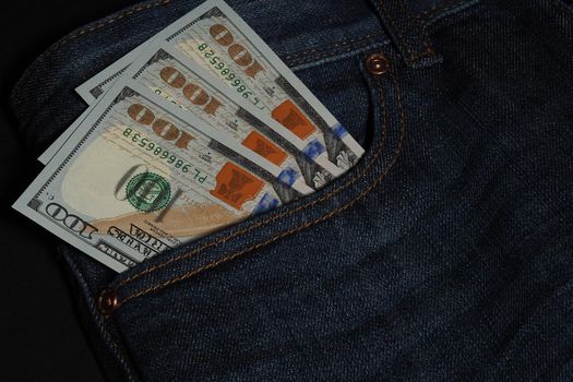 Cash, American currency, dollars in jeans pocket. High quality photo