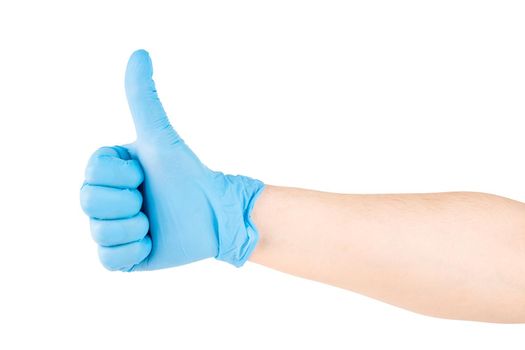 right caucasian hand in blue latex medical glove showing thumb up gesture, isolated on white background