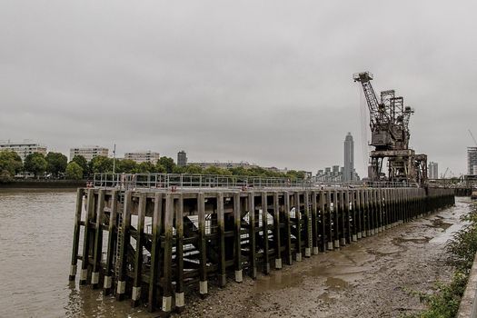 Wide-shot of the old pier bi the River Thames at Battersea Power Station