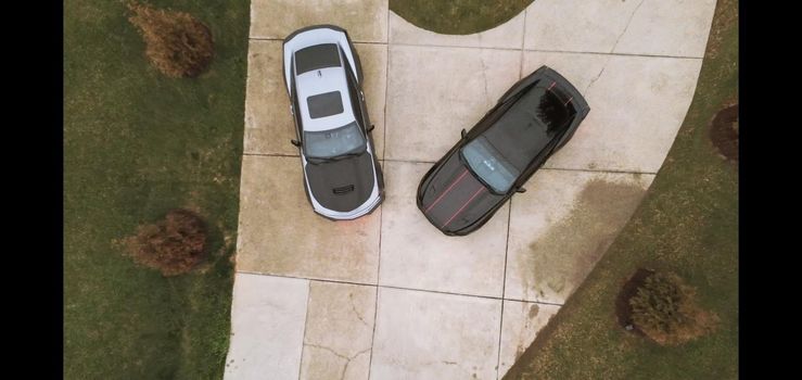 two cars parked in private driveway