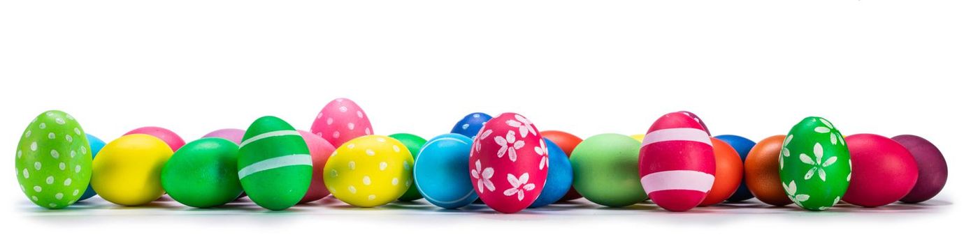 A row of decorated easter eggs isolated on white background