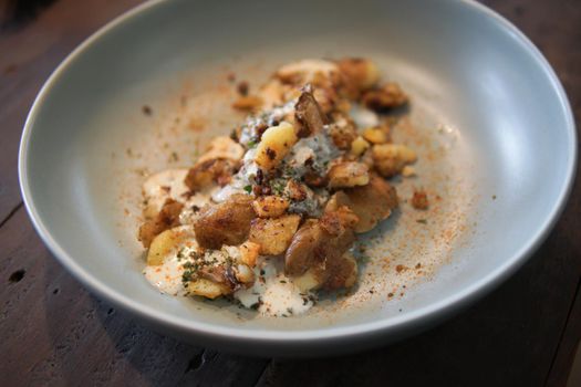 baked roasted potatoes with sour cream sauce and herb