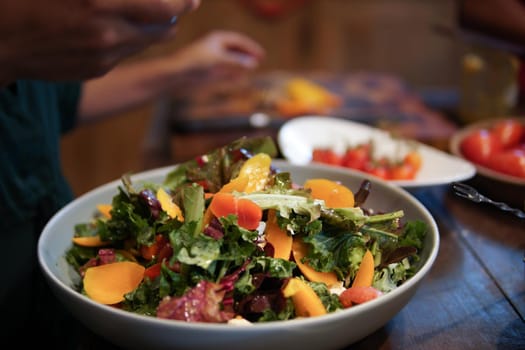 woman preparing cooking making vegetable salad in kitchen
