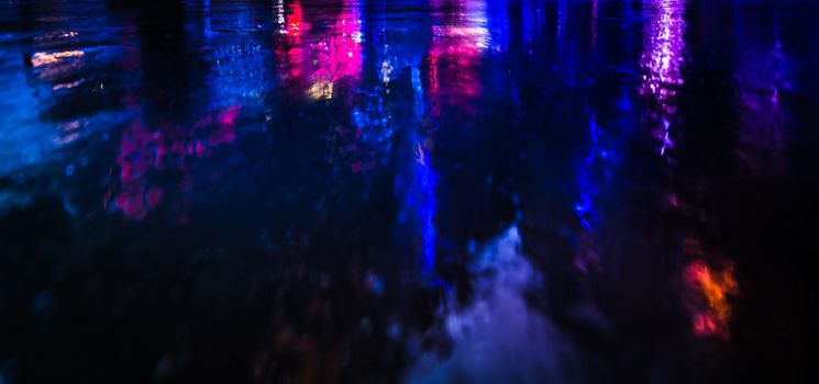 Illumination and neon night lights of NYC. Abstract image of neon lights on the streets of New York City. Multiple exposure and intentional motion blur