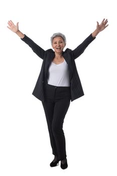 Mature asian business woman winner with raised arms isolated on white background full length studio portrait