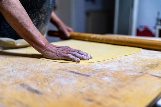 detail roll out the dough with a rolling pin and then make tagliatelle