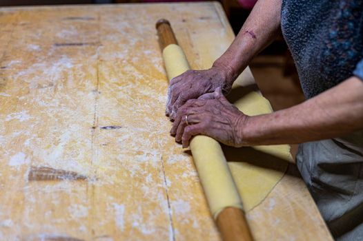 detail roll out the dough with a rolling pin and then make tagliatelle