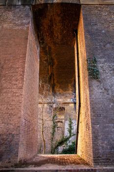 Arches and brick columns under a railway viaduct