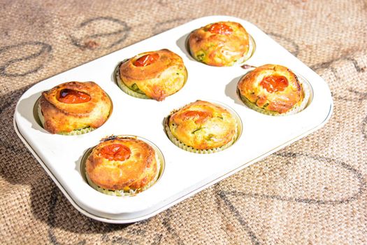 finger food of typical Italian cuisine muffins with homemade vegetables and ricotta