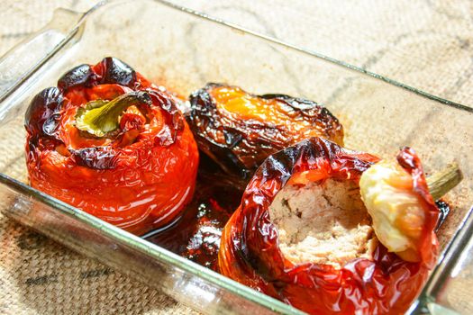 Italian cuisine, baked stuffed peppers with tuna capers and Parmesan cheese