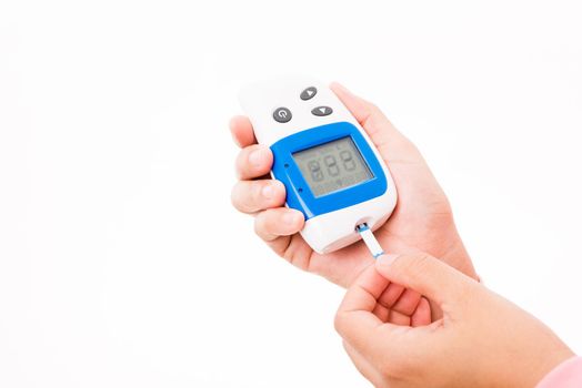 Closeup hands woman measuring glucose test level checking on a finger by glucometer she monitors and controls high blood sugar diabetes and glycemic health care concept isolated on white background