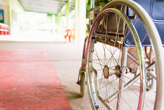 Closeuo empty wheelchairs in the hospital parked waiting for physical patient services, medical care concept