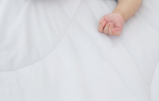 Portrait of asian little baby girl sleeping on bed in the bedroom at home, newborn napping with cozy and relax, infant innocence in bedtime, happy toddler cute, growth of child and emotion, indoors.