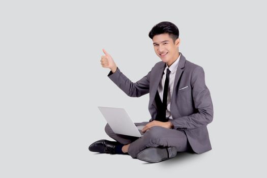 Young asian business man sitting work on laptop computer to internet online isolated on white background, businessman confident and notebook, freelance with success, marketing and communication.
