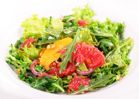 salad of leaves with grapefruit, orange and pine nuts