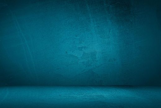 Vintage grunge blue concrete texture studio wall background with vignette