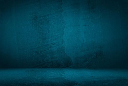 Vintage grunge blue concrete texture studio wall background with vignette