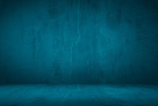 Vintage grunge blue concrete texture studio wall background with vignette