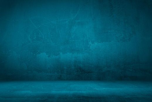 Vintage grunge blue concrete texture studio wall background with vignette