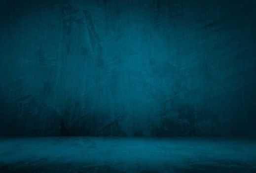 Vintage grunge blue concrete texture studio wall background with vignette