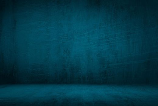 Vintage grunge blue concrete texture studio wall background with vignette