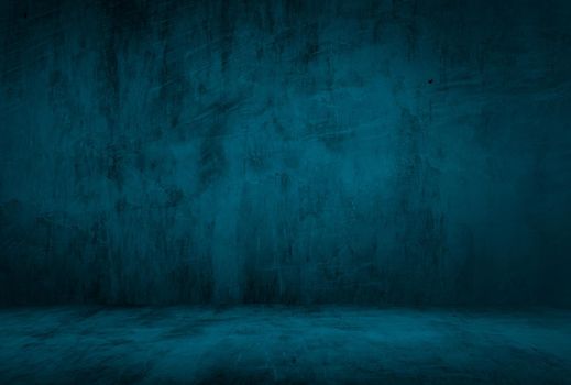 Vintage grunge blue concrete texture studio wall background with vignette