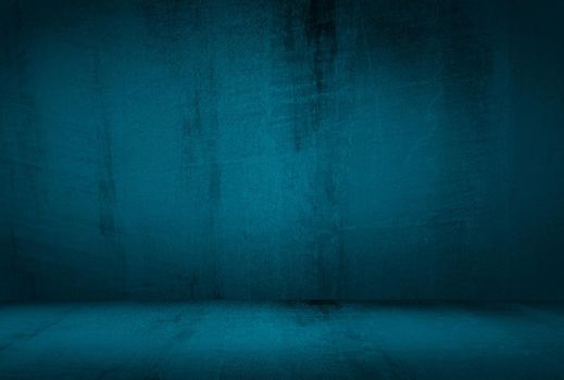 Vintage grunge blue concrete texture studio wall background with vignette