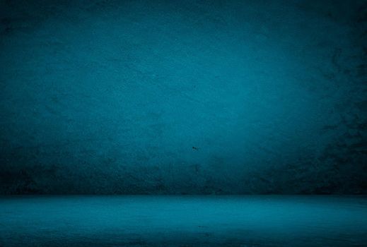 Vintage grunge blue concrete texture studio wall background with vignette