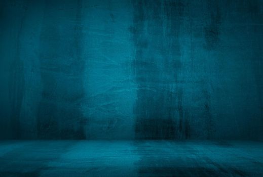 Vintage grunge blue concrete texture studio wall background with vignette