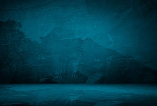 Vintage grunge blue concrete texture studio wall background with vignette