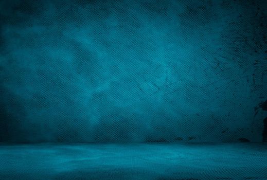 Vintage grunge blue concrete texture studio wall background with vignette