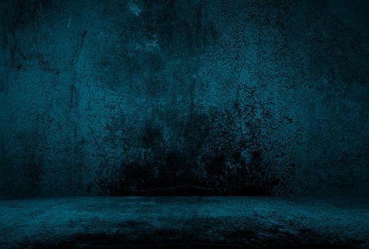 Vintage grunge blue concrete texture studio wall background with vignette