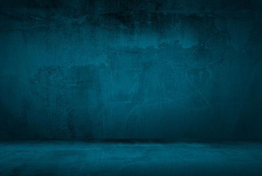 Vintage grunge blue concrete texture studio wall background with vignette