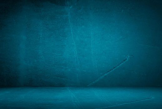 Vintage grunge blue concrete texture studio wall background with vignette