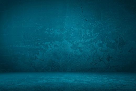 Vintage grunge blue concrete texture studio wall background with vignette