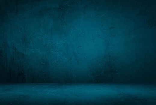 Vintage grunge blue concrete texture studio wall background with vignette