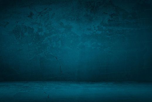 Vintage grunge blue concrete texture studio wall background with vignette