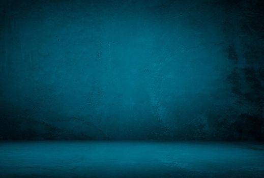 Vintage grunge blue concrete texture studio wall background with vignette