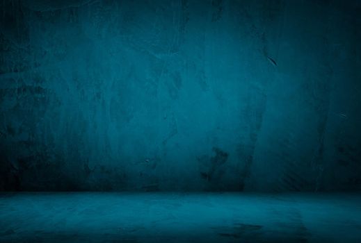 Vintage grunge blue concrete texture studio wall background with vignette