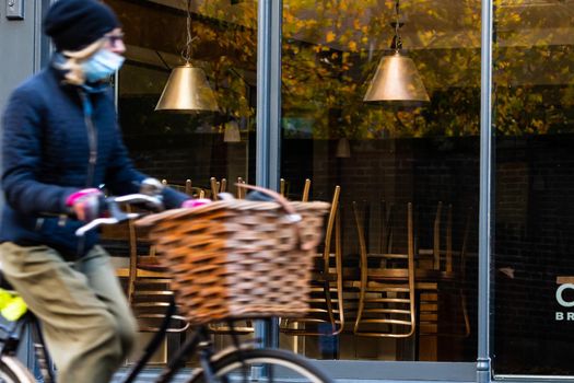 Chairs on the tables of a restaurant forced to close during lockdown to control COVID-19 pandemic, Cambridge, UK